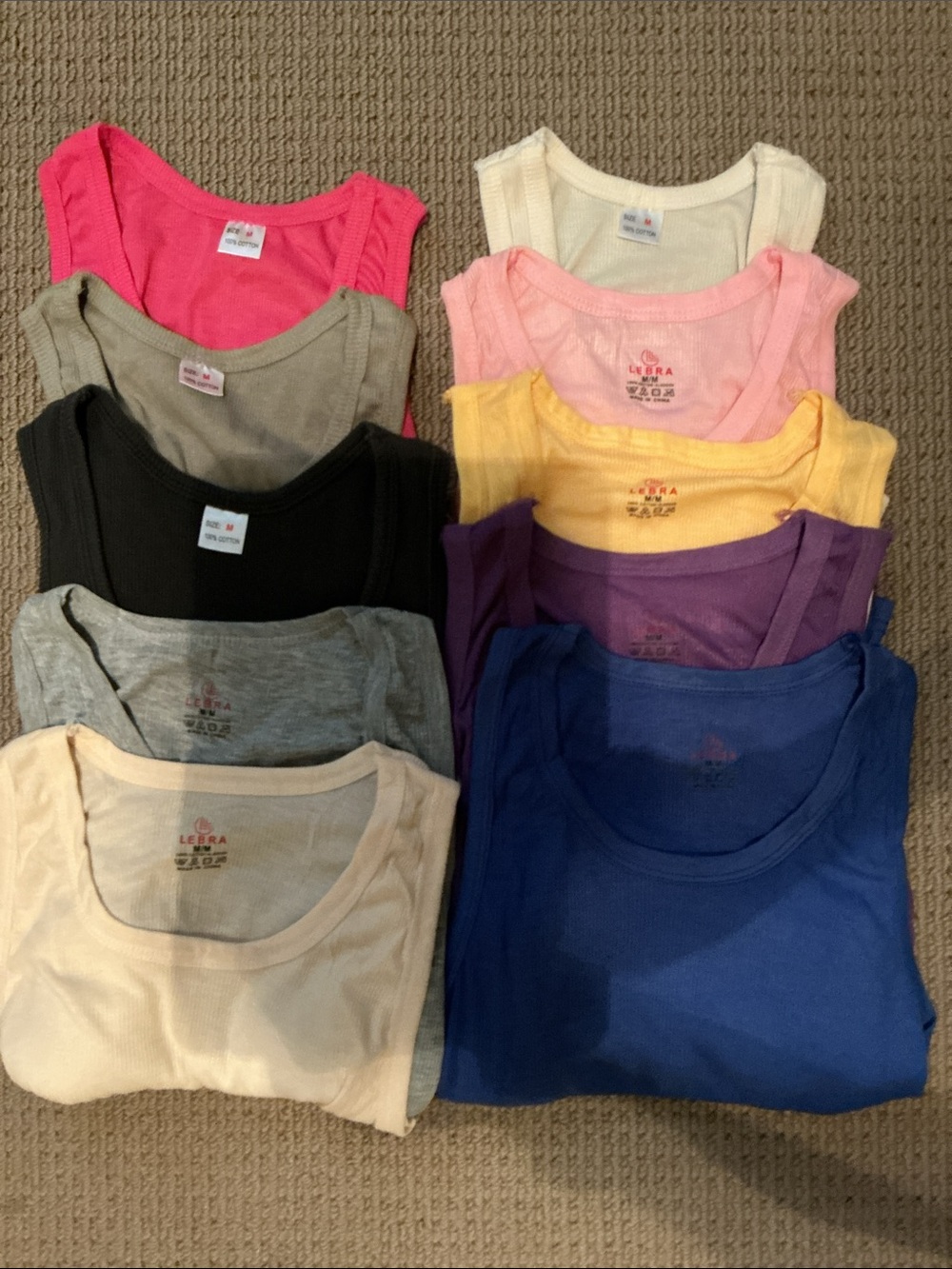 10 tank tops. Size medium but fits small.